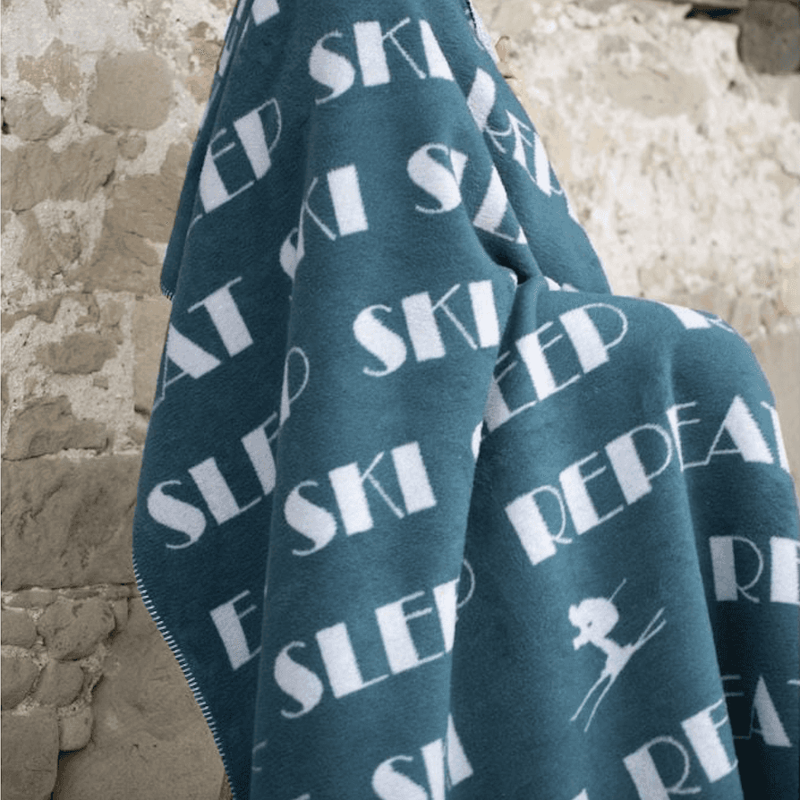 Immagine principale di Coperta Singola invernale in Cotone Eat Ski Sleep Repeat 150x200 cm (3 Colo | David Fussenegger